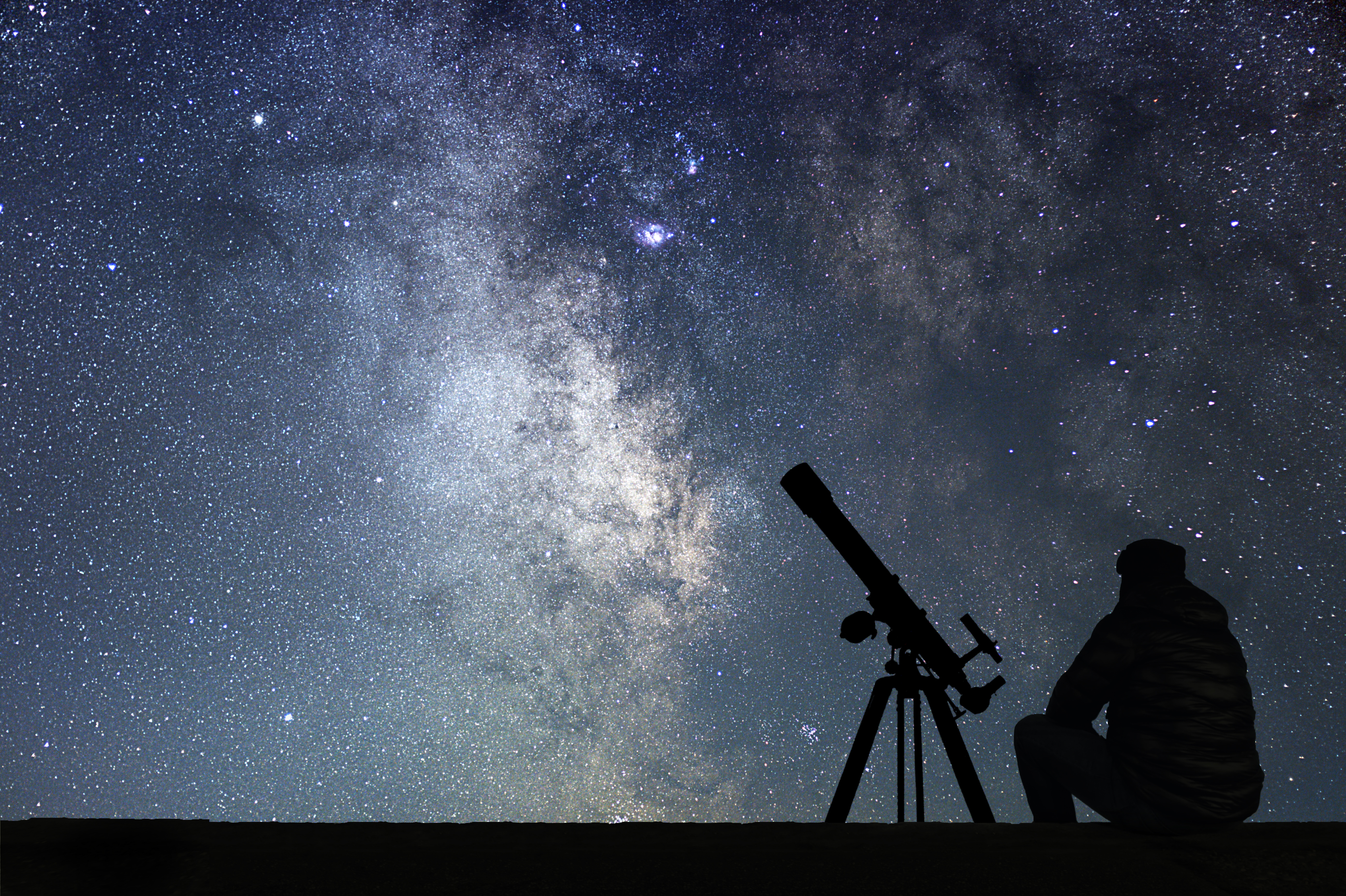 night sky with person and telescope