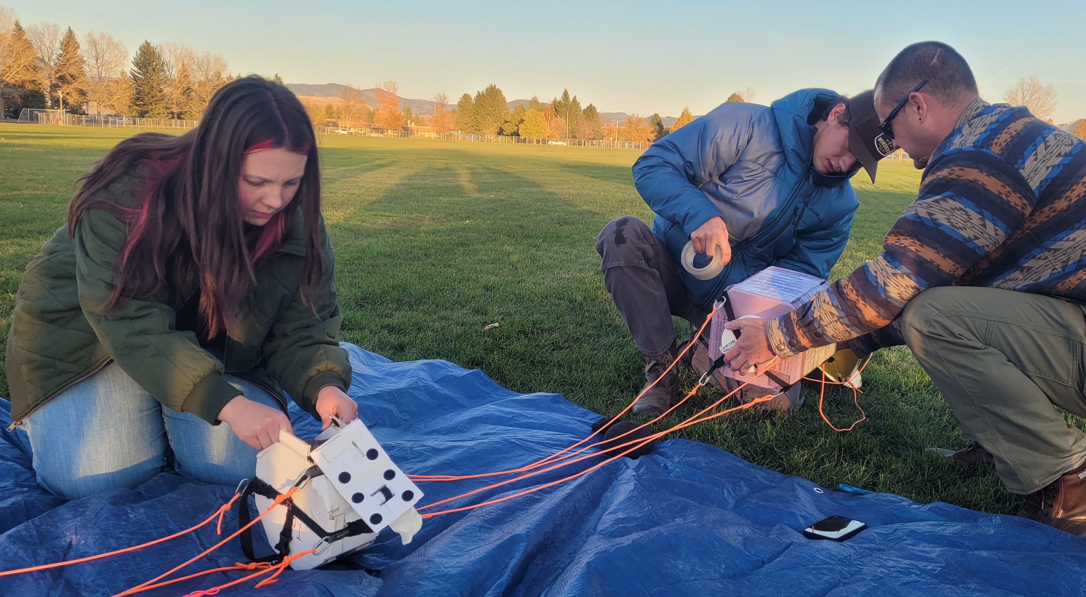 Apprentice Students (Jasmine Hruska and Kyle Henry) preparing payloads for a balloon
