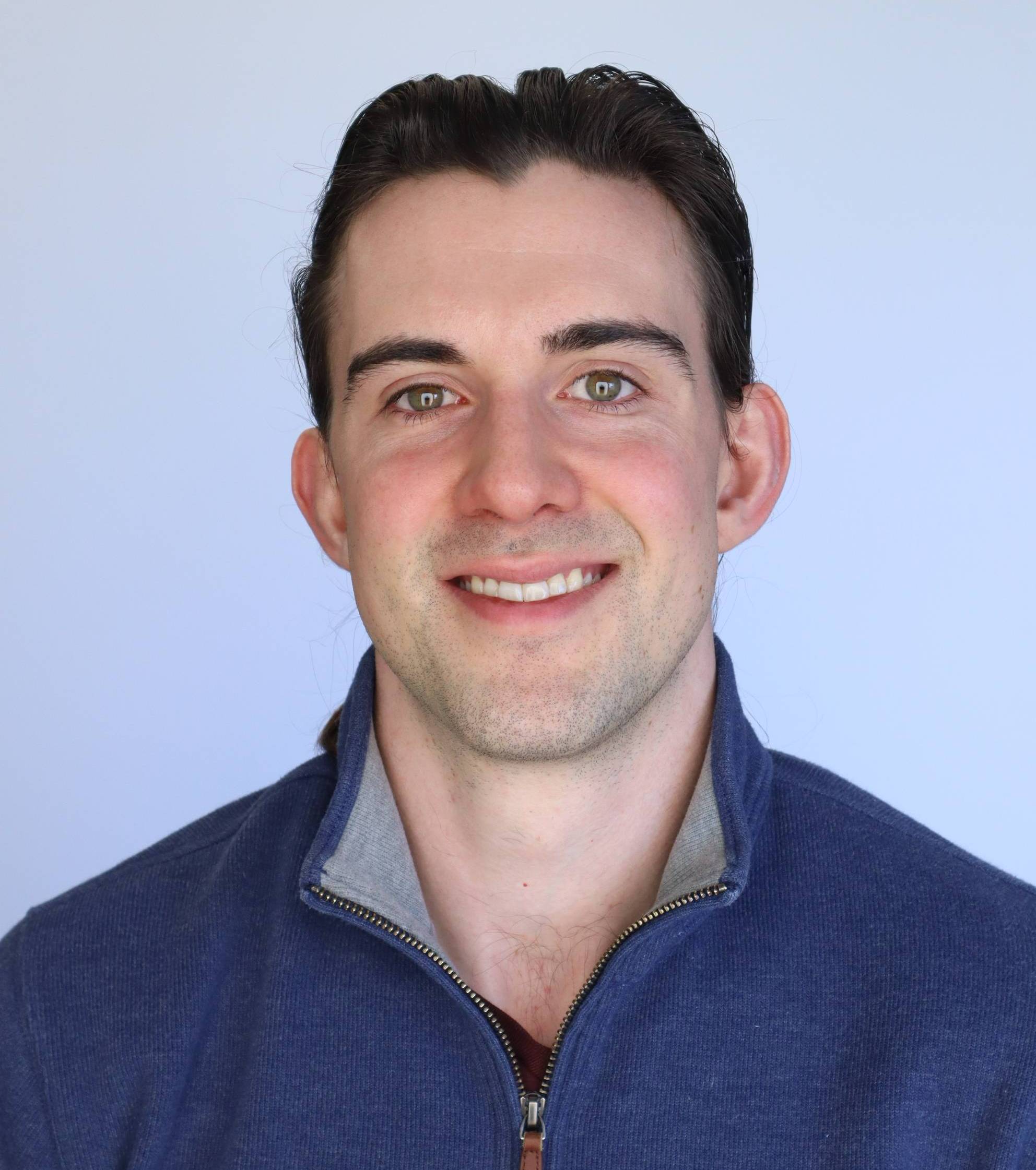 A headshot of Joseph Knudsen